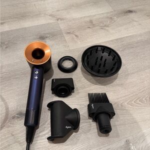 Dyson supersonic Hair Dryer in Blue and Orange with Black Attachments